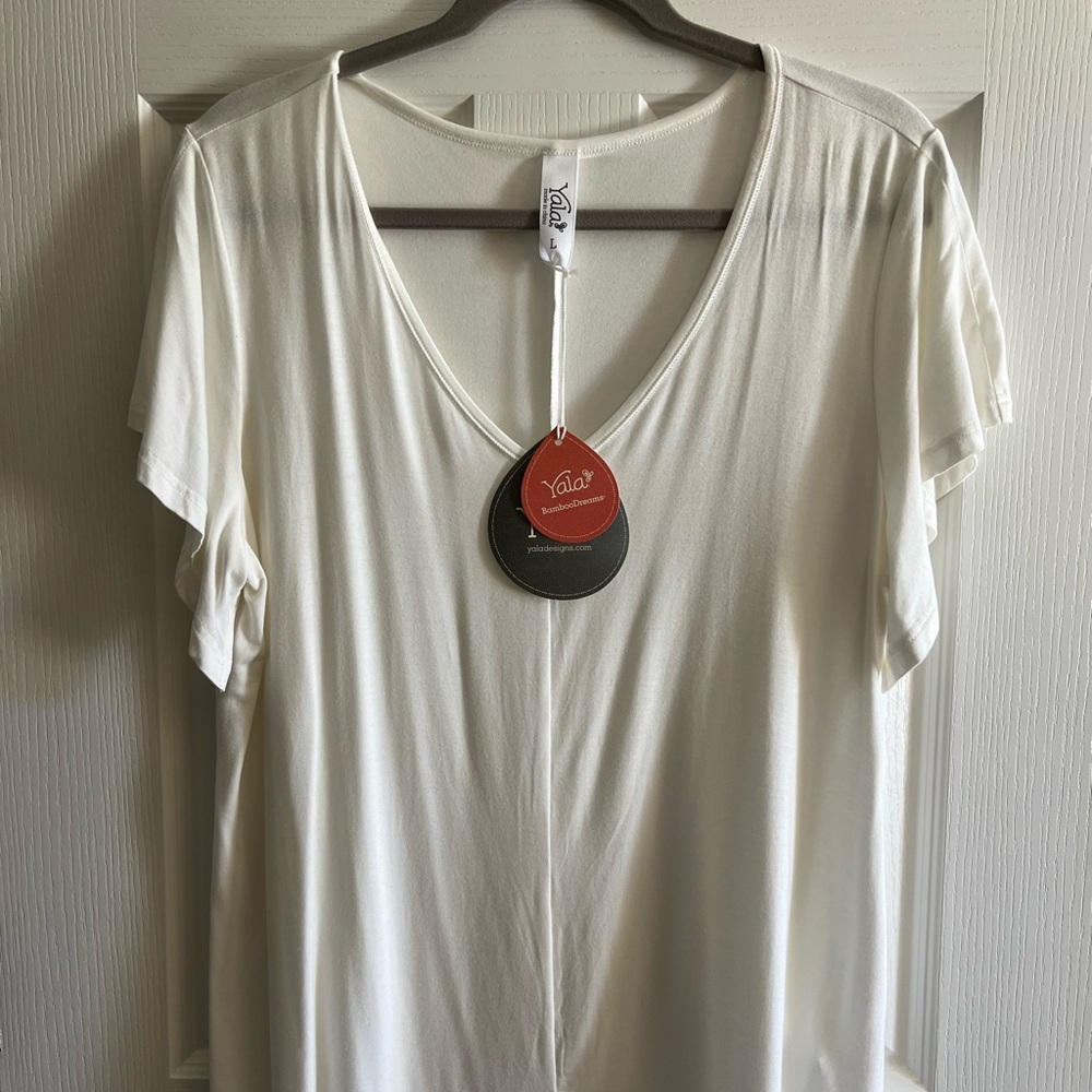YALA short sleeved, V neck shirt.